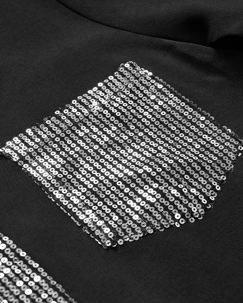 Luźny top z guzikami i cekinami