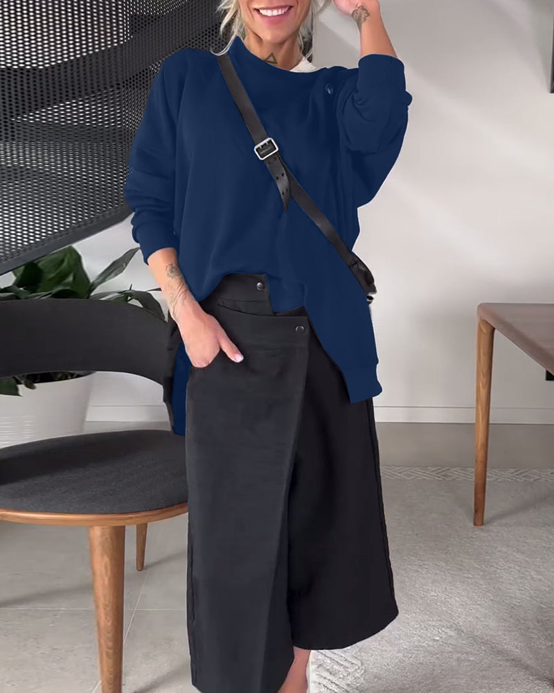 Prosta, swobodna bluza z okrągłym dekoltem i rozcięciem