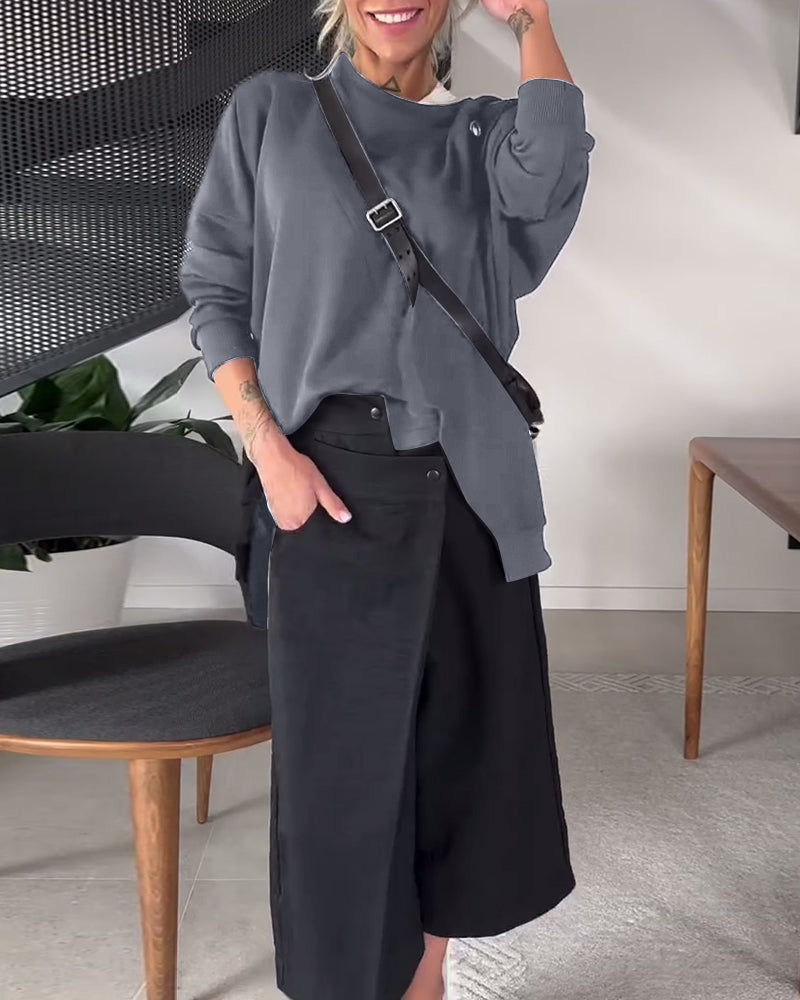 Prosta, swobodna bluza z okrągłym dekoltem i rozcięciem