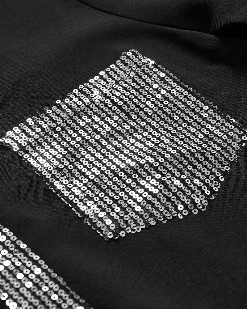 Luźny top z guzikami i cekinami