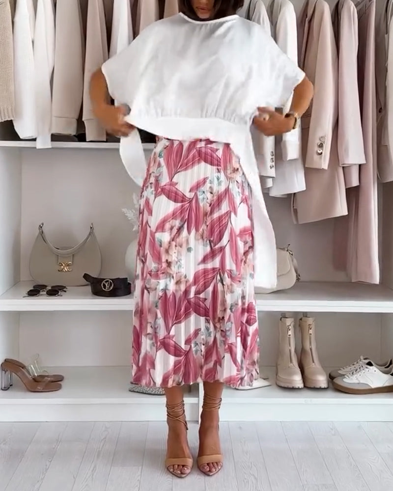 Bluzka w jednolitym kolorze, z kokardą w talii i krótkim rękawem