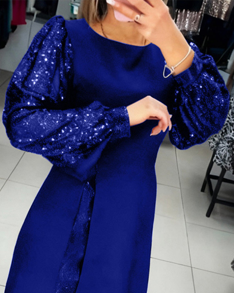 Elegancka sukienka z bufiastymi rękawami i patchworkowymi detalami