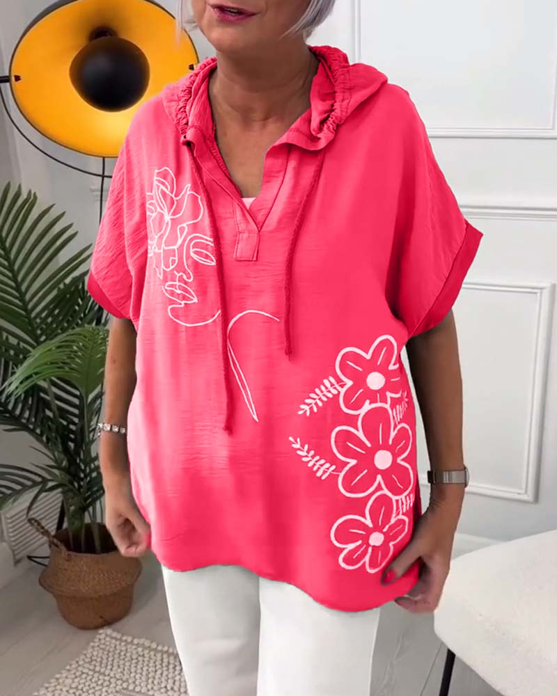 Luźna bluzka z krótkim rękawem i nadrukiem kwiatowym z kapturem
