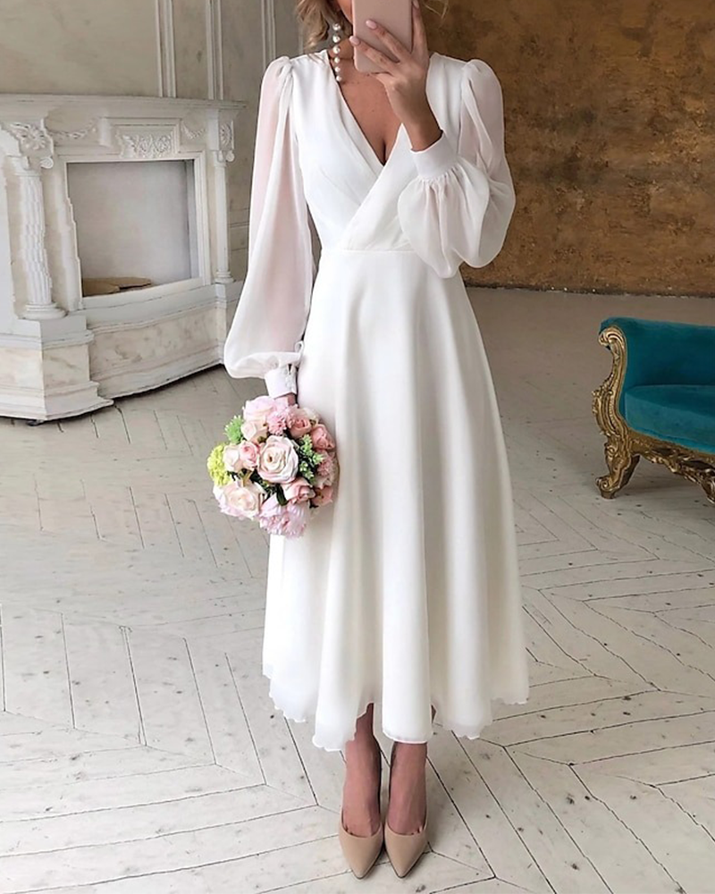 Sukienka Elegancka z bufiastymi rękawami i dekoltem w serek