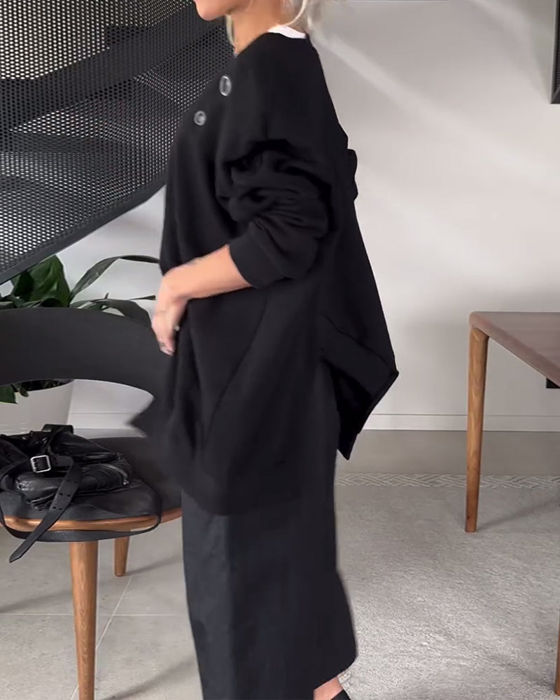 Prosta, swobodna bluza z okrągłym dekoltem i rozcięciem