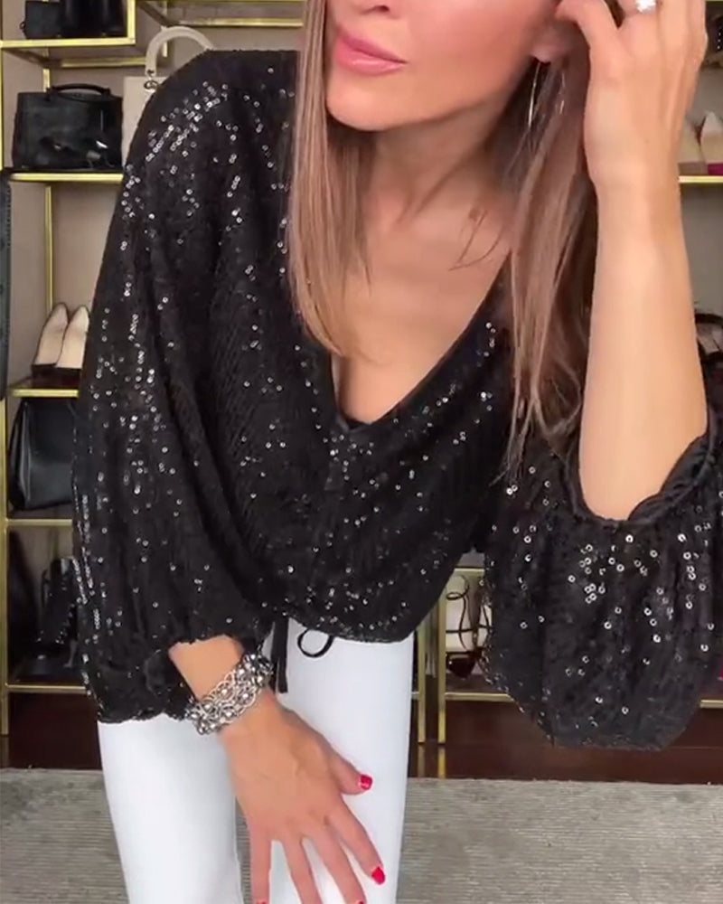 Bluzka z dekoltem w serek, rękawami typu lampion i cekinami