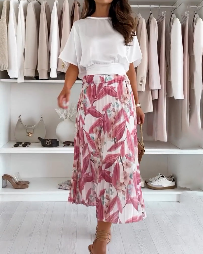 Bluzka w jednolitym kolorze, z kokardą w talii i krótkim rękawem