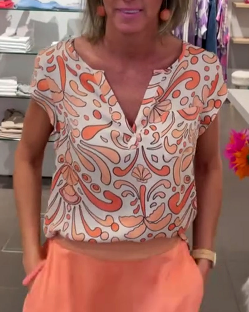 Bluzka casualowa z dekoltem w serek i rękawami typu raglan z nadrukiem