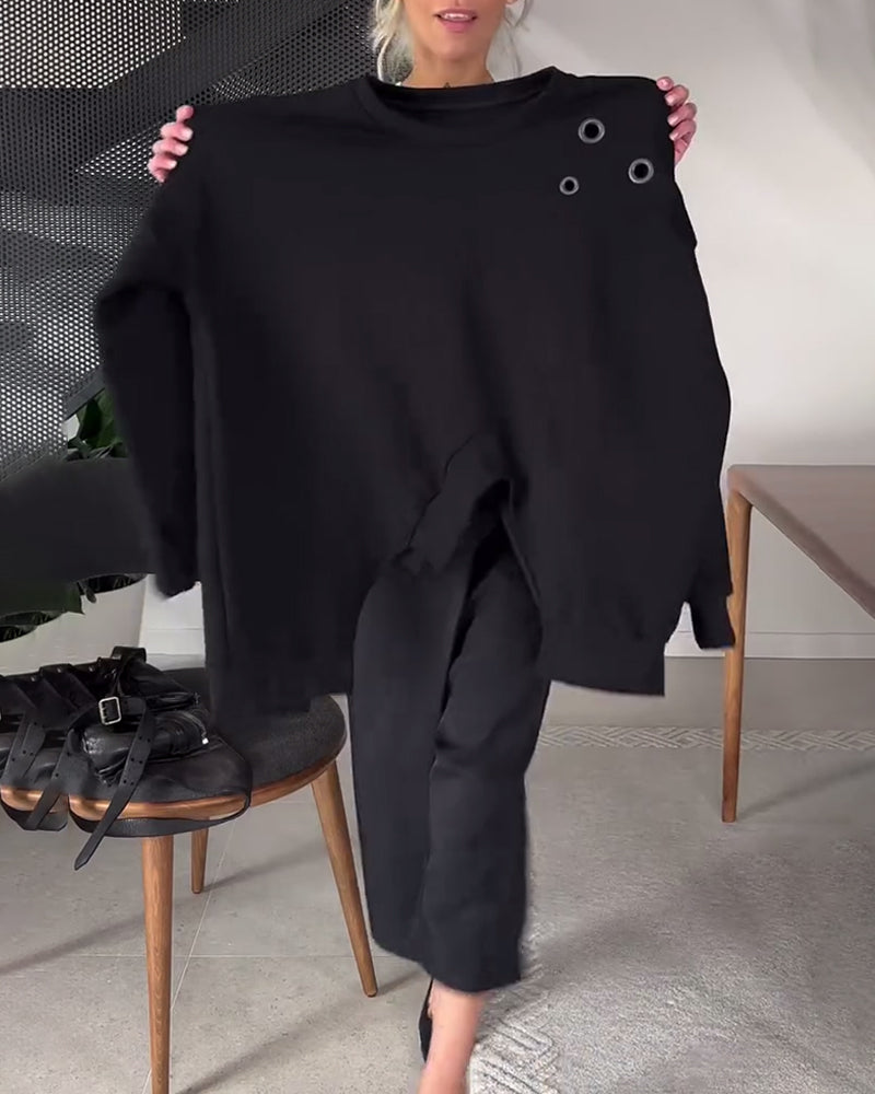 Prosta, swobodna bluza z okrągłym dekoltem i rozcięciem