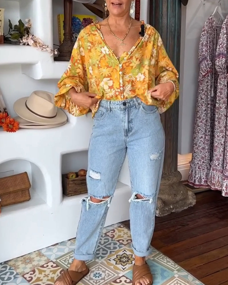 Bluzka z kwiatowym nadrukiem i dekoltem w serek