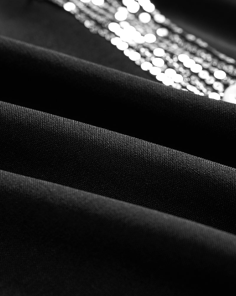 Luźny top z guzikami i cekinami